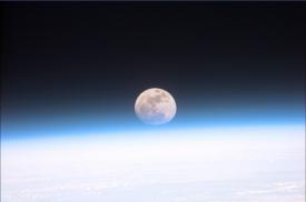 Full moon partially obscured by the atmosphere (NASA)